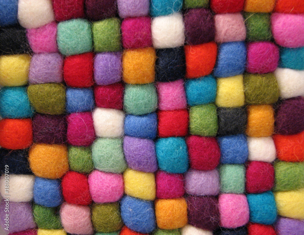 Texture of fabric made of colored felt balls close up. Texture of fabric made of colored felt balls close up.