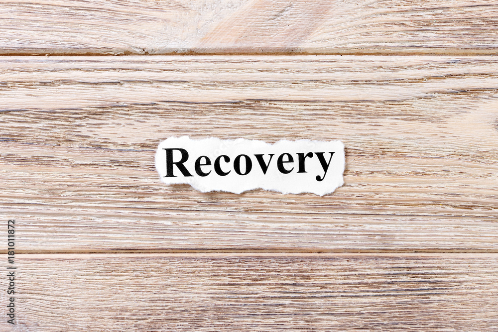 Recovery of the word on paper. concept. Words of Recovery on a wooden background Recovery of the word on paper. concept. Words of Recovery on a wooden background