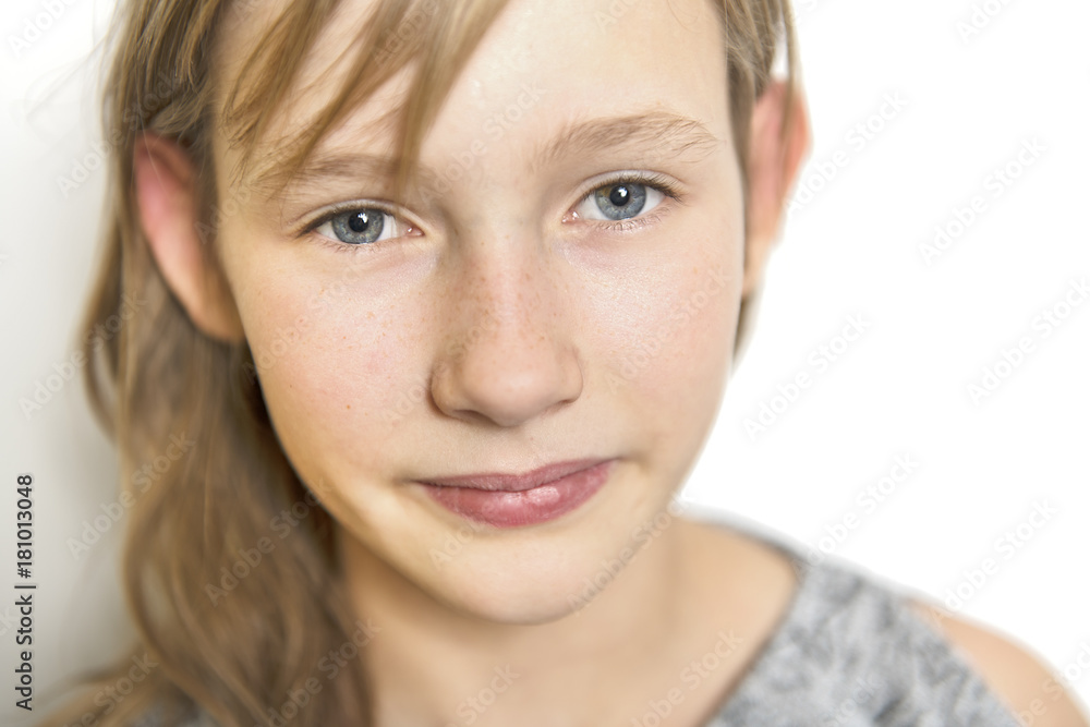 cute cheerful little girl portrait, isolated on grey background red head