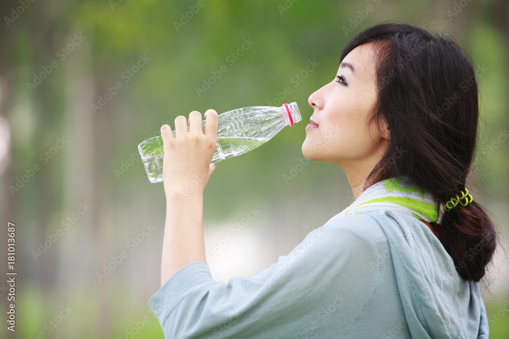 pretty young woman drinking water from the bottle pretty young woman drinking water from the bottle