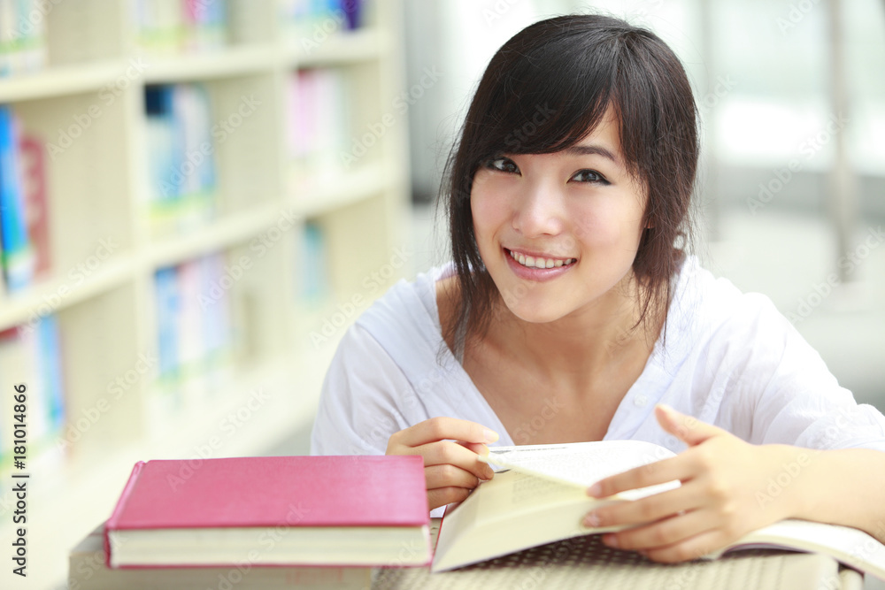 pretty asian college student in library pretty asian college student in library