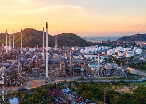 Aerial view Oil refinery.Industrial view at oil refinery plant form industry zone with sunrise and cloudy sky.Oil refinery and Petrochemical plant at dusk Thailand. Oil refinery background sunset