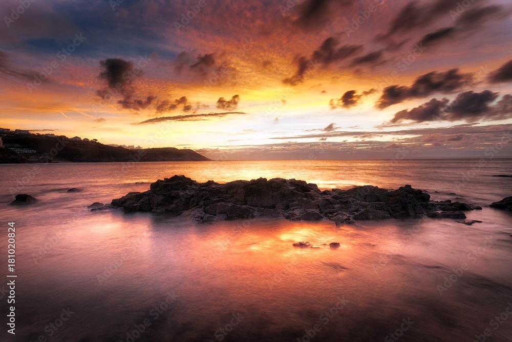 Sunrise at Langland Bay on the Gower peninsula coast in Swansea, South Wales, UK