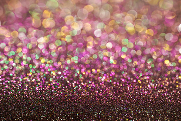 colorful pastel purple pink green bokeh light glitter background for Christmas and New Year's day