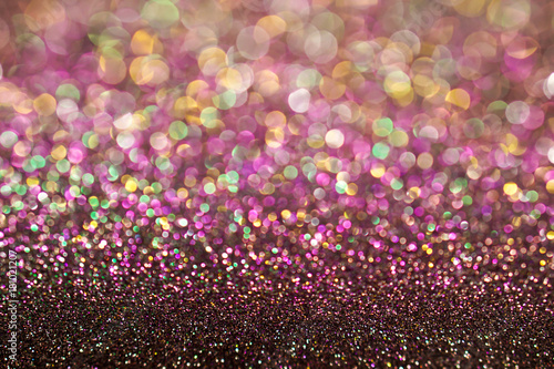 colorful pastel purple pink green bokeh light glitter background for Christmas and New Year's day