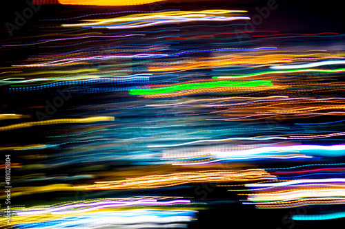 Beautiful lighting of Night futuristic line LED building abstract, Shooting style light color blur in Swirled night lights busy city abstract background. Movement of origin of multi colored lights.