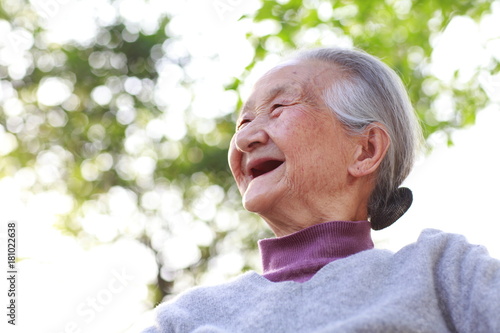 Photo close up of one happy senior asian woman