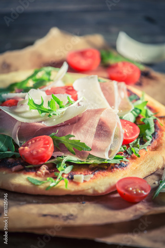 Delicious pizza with tomatoes, basil and cheese