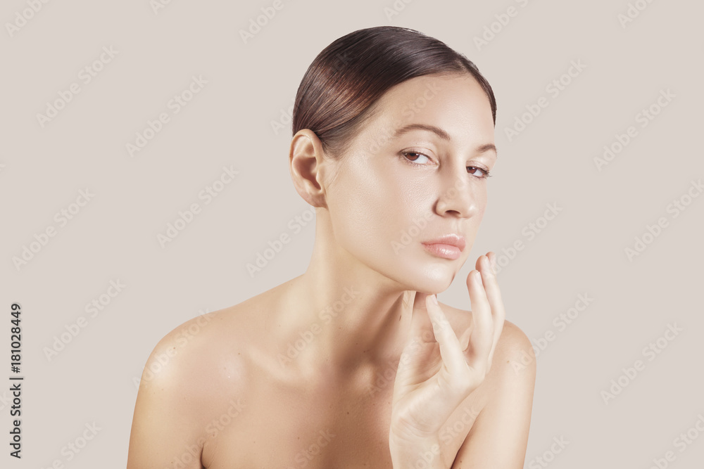 Beauty portrait of a very beutiful brown hair european young girl, nude make up. Studio shoot, white background. Beauty portrait of a very beutiful brown hair european young girl, nude make up. Studio shoot, white background.