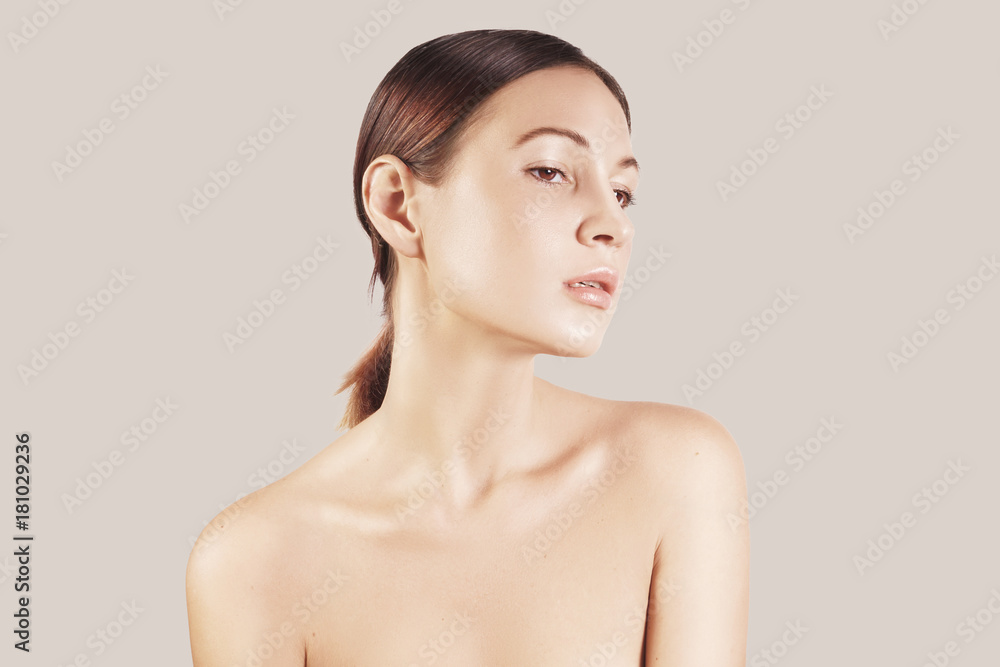 Beauty portrait of a very beutiful brown hair european young girl, nude make up. Studio shoot, white background. Beauty portrait of a very beutiful brown hair european young girl, nude make up. Studio shoot, white background.