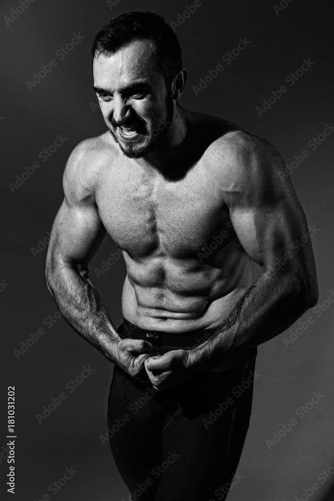 Fototapeta premium Muscular screaming man with a naked torso.