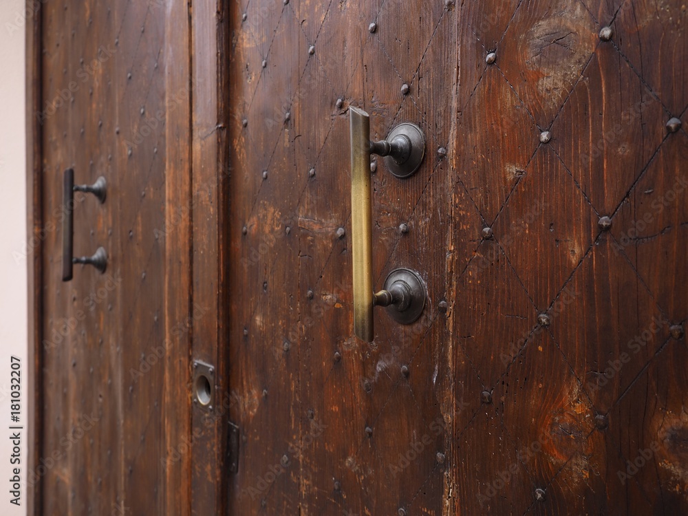 Fototapeta premium Old wood door with big handles.