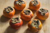 Top View of Persimmons on Cutting Board
