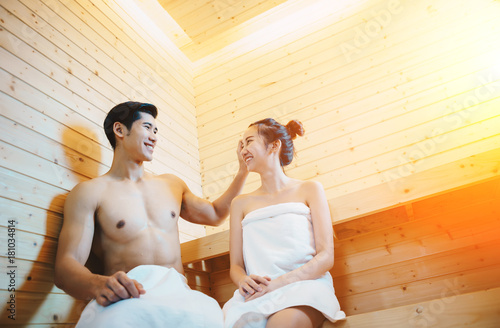 Couple, man and woman were sitting and drinking wine in the sauna, which I installed in their beautiful home.