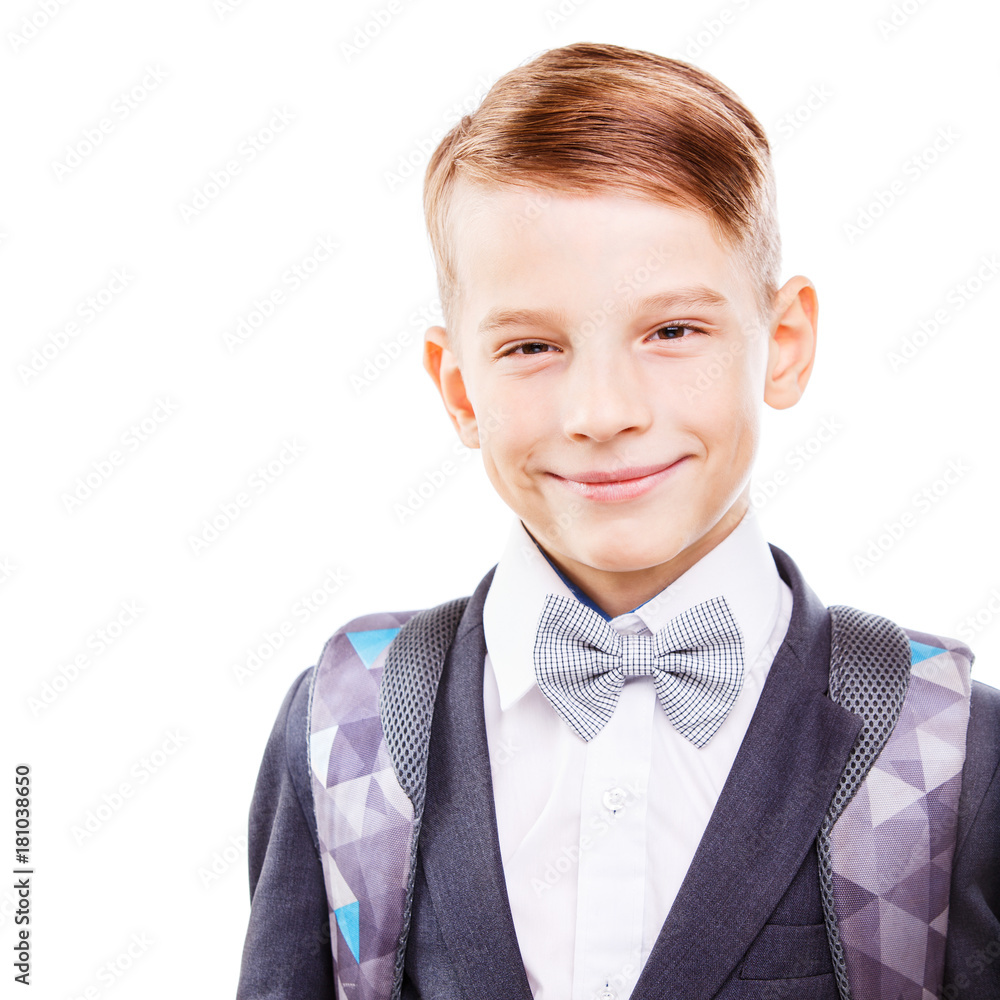 Portrait of happy schoolboy with backpack isolated on white background. Smiling primary schoolchild in suit Portrait of happy schoolboy with backpack isolated on white background. Smiling primary schoolchild in suit