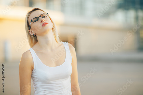 Business woman wearing glasses with a frustrated expression of the face