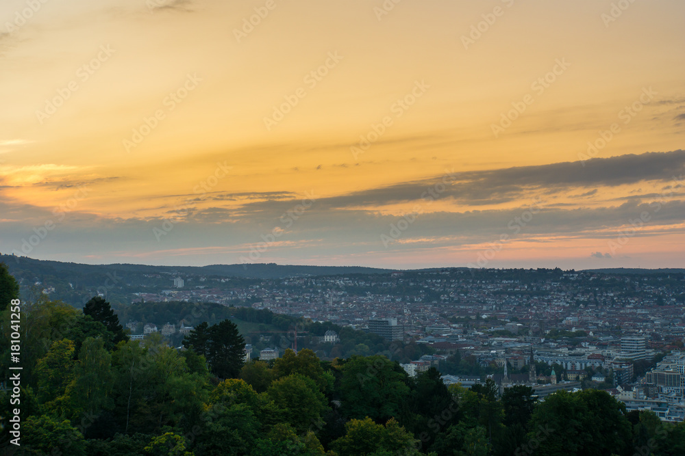 Wide view over the roofs of the city of stuttgart from above at beautiful sunset