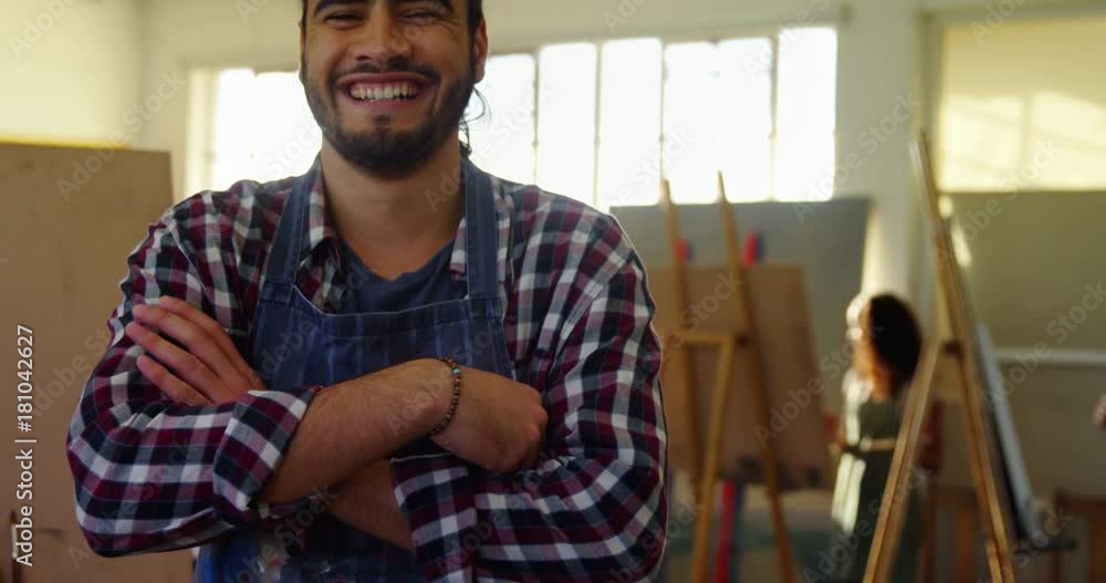 Portrait of happy man standing with arms crossed Portrait of happy man standing with arms crossed