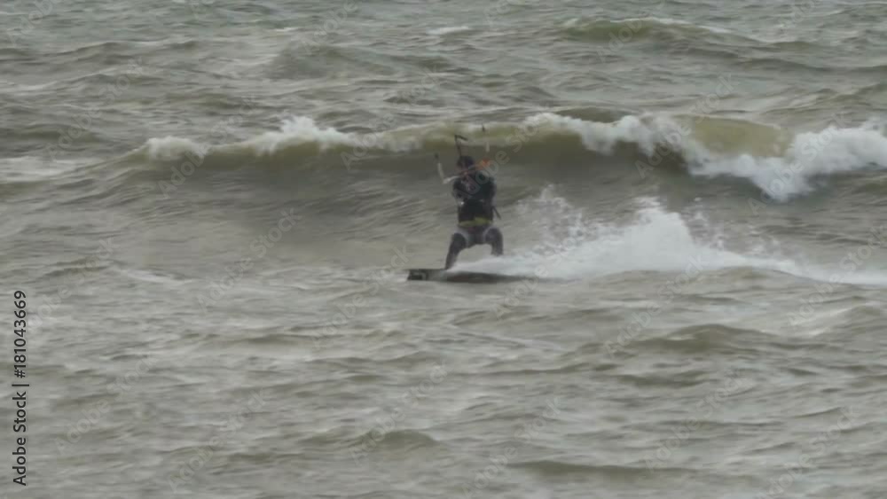 Kiteboarding, Fun in the ocean, Extreme Sport. Extreme Kitesurfing in stormy weather. Summer Ocean Sport in Slow Motion. Kiteboarding, Fun in the ocean, Extreme Sport. Extreme Kitesurfing in stormy weather. Summer Ocean Sport in Slow Motion.