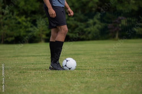 Football player ready to kick the soccer ball © wavebreak3