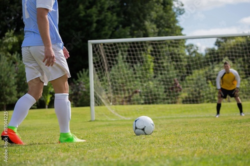 Obraz na plátně Soccer player is ready to kick ball from penalty spot