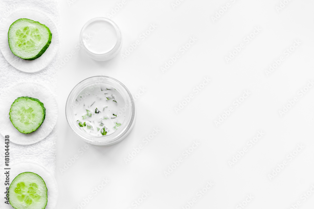 Cucumber moisturising cream or mask pattern. White background top view copyspace Cucumber moisturising cream or mask pattern. White background top view copyspace