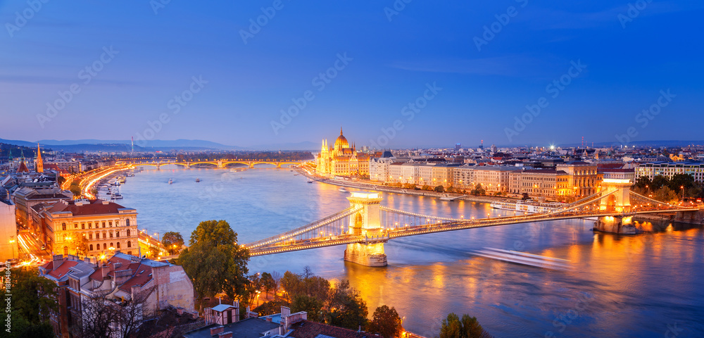 Budapest, panoramic view from above, night scenery, city lights glowing, Danube river delta scenic curved. Budapest is popular and famous European travel destination.
