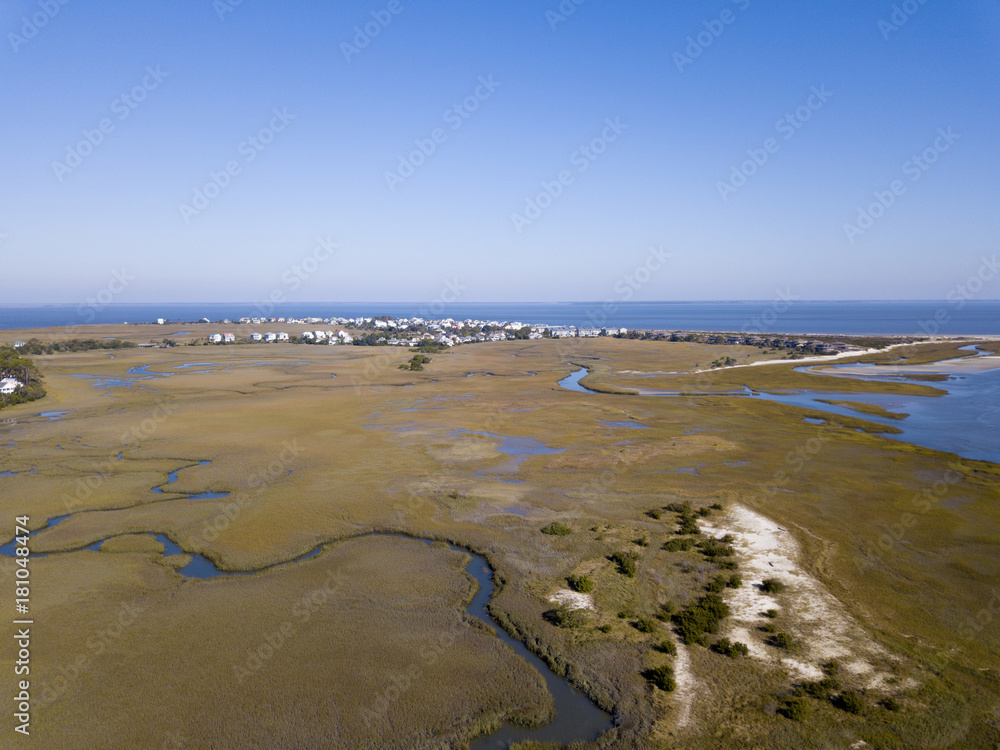 Aerial view of beach front homes and island on the South Carolina coast.