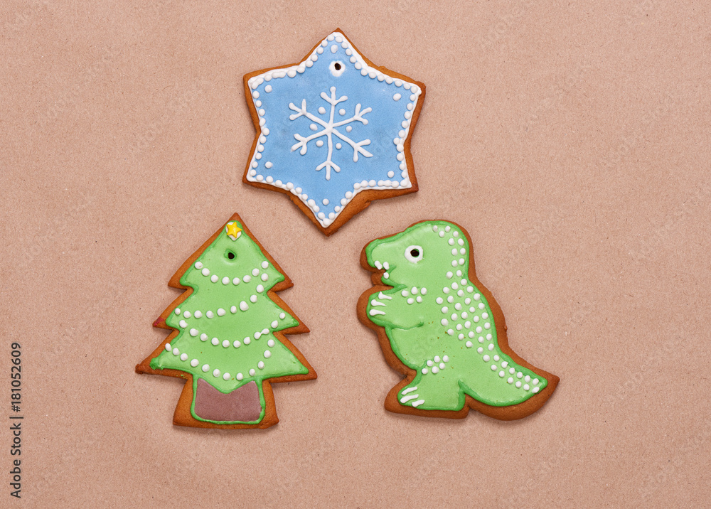 Gingerbread cookies for Christmas on a brown background