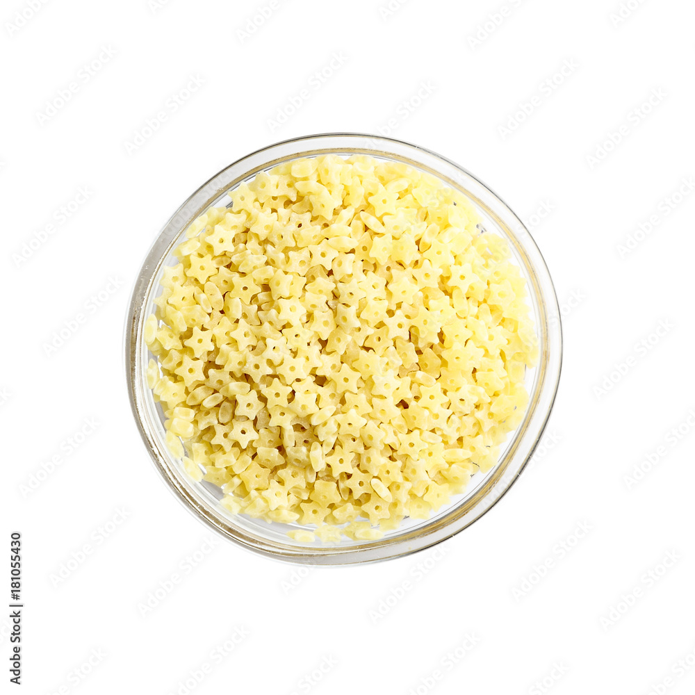 Stelline Stars pasta in glass bowl. Isolated Stelline Stars pasta in glass bowl. Isolated