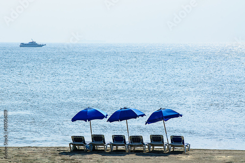 Three Umbrellas and a Boat