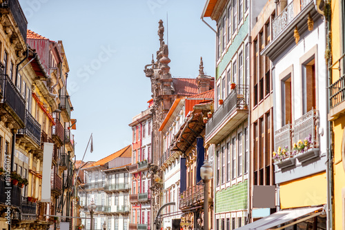 Street view on the beautiful old buildings with portuguese tiles on the facades in Porto city, Portugal