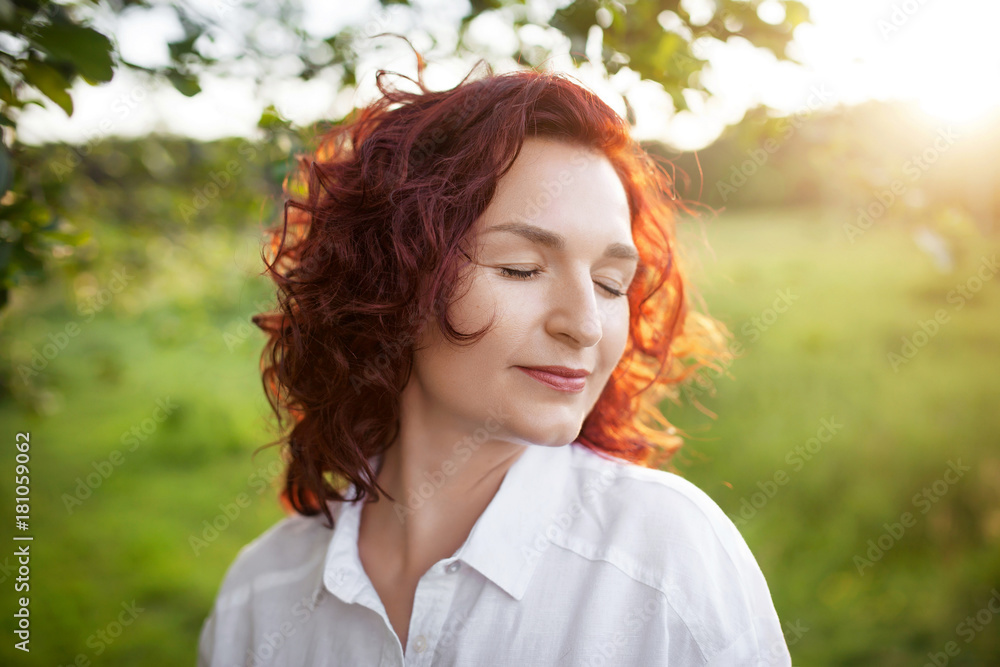 portrait of a beautiful woman on a summer meadow portrait of a beautiful woman on a summer meadow