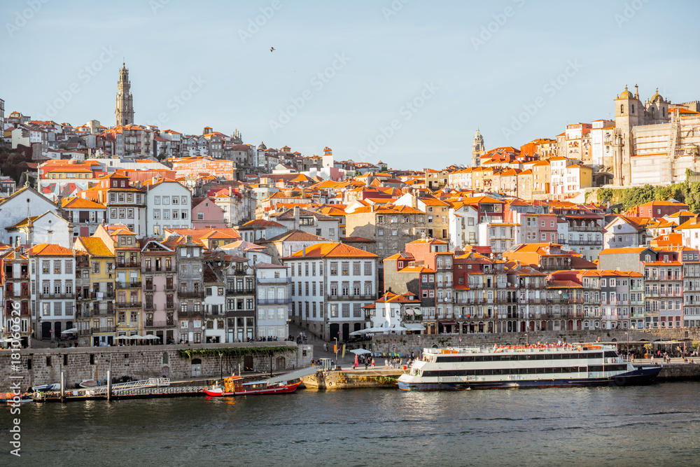 Landscape view on the old town on the riverside of Douro river in Porto during the sunset in Portugal