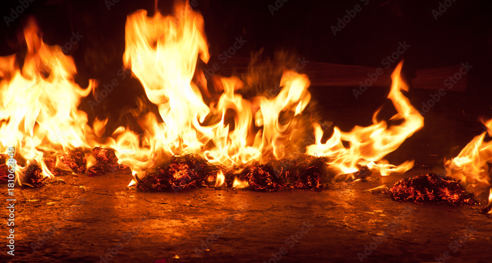 Burning fire stone on a floor background Burning fire stone on a floor background