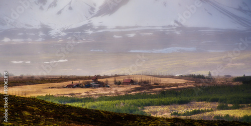 Icelandic landscape. Farm on the background of mountains. Mosfellsbaer  Iceland.