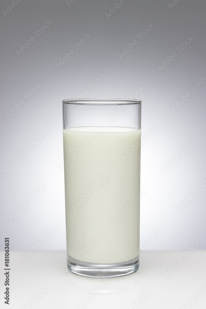 Glass of milk with a light gradient on the background Glass of milk with a light gradient on the background