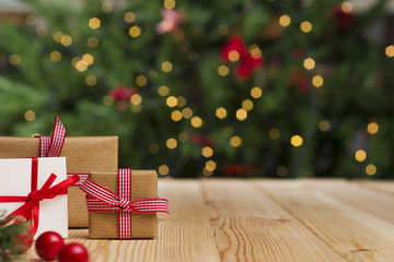 Christmas gifts on table, Christmas tree background