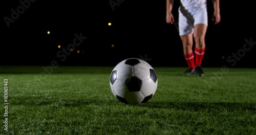 Soccer player kicking the ball 