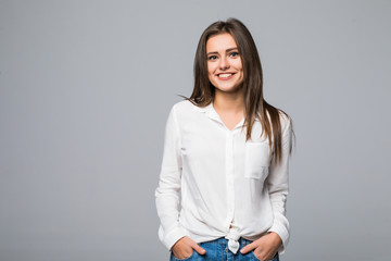 Close up portrait of a woman standing against gray background