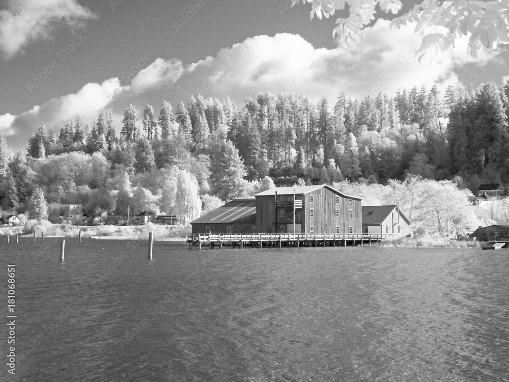 Old net shed and other buildings from Astoria's river walk as it crossed a railroad trestle Old net shed and other buildings from Astoria's river walk as it crossed a railroad trestle