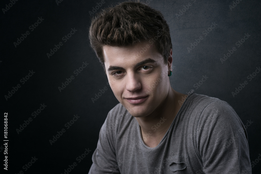 Smiling handsome young man posing Smiling handsome young man posing