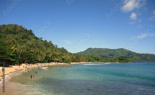 Beautiful beach with green hill on the background