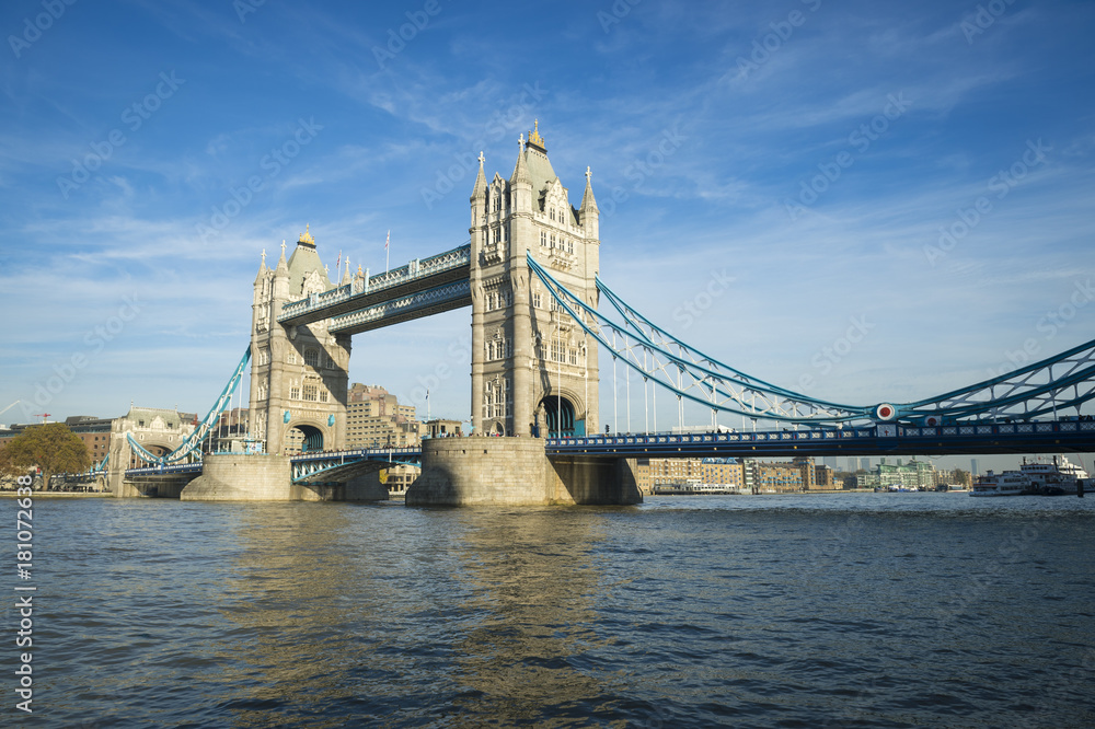 Scenic landscape view of Tower Bridge standing tall in afternoon light above the River Thames as viewd from the South Bank in London, England