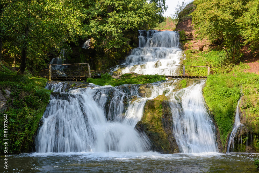 Obraz premium Chervonogorodsky, Dzhurynsky waterfall in Nyrkiv on the Dzhuryn river. Ternopilska oblast, Ukraine.