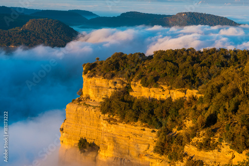 Cliffs in the Tavertet abyss covered with fog at dawn in the Collsacabra area