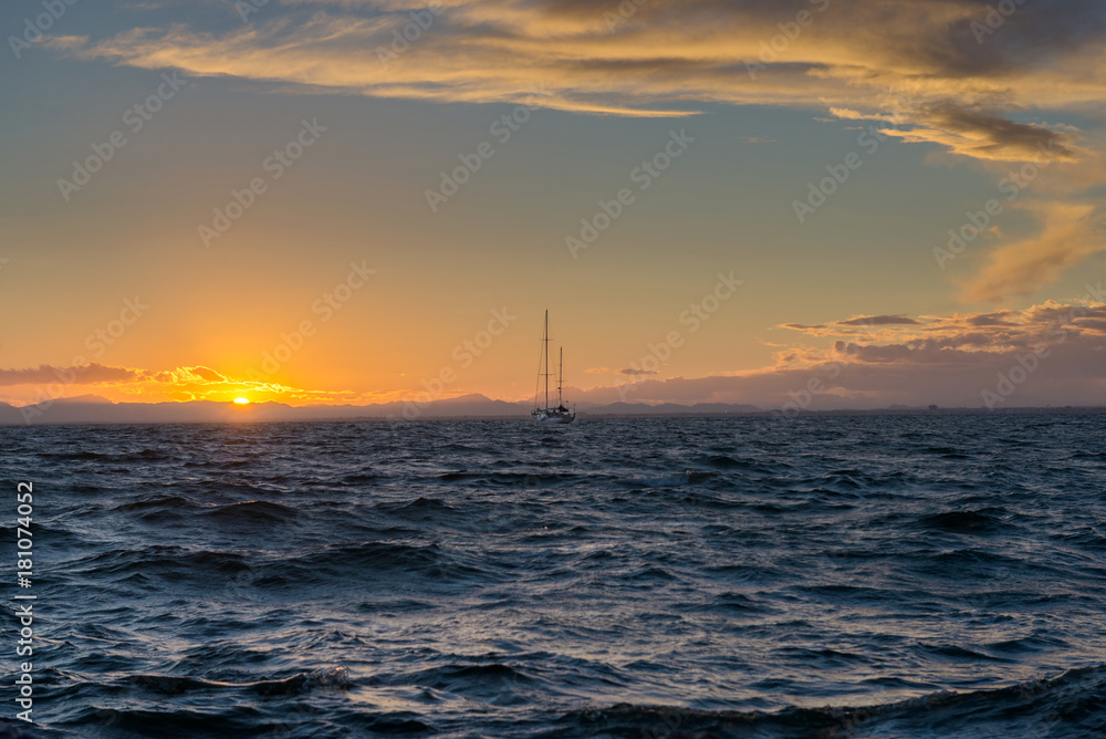 Sailing yacht and sunset in the sea. La Manga. Spain.

