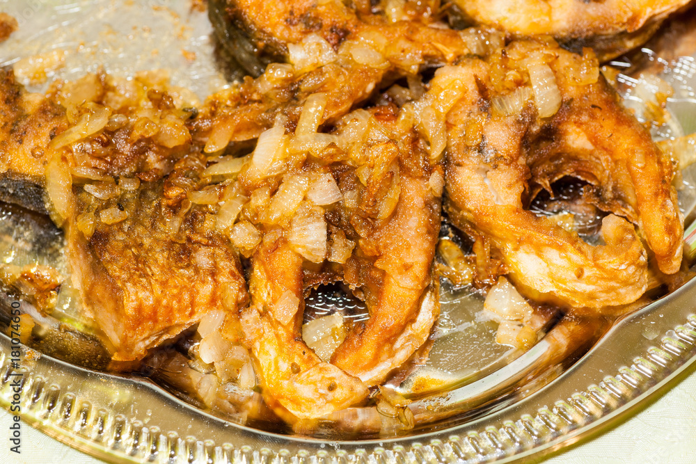 Dish from pieces of fried river fish for dinner in Russia Dish from pieces of fried river fish for dinner in Russia