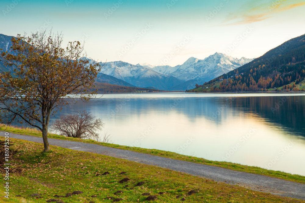 Lake Resia at sunset in the Italian Alps