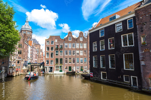 Photography Canal and St. Nicolas Church in Amsterdam